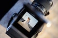 Shooting a wedding with a vintage camera Royalty Free Stock Photo