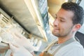 Shop assistant holding cheese Royalty Free Stock Photo