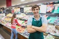 Shop assistant posing with arms crossed Royalty Free Stock Photo