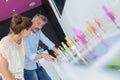 shop assistant showing vaporiser to customer Royalty Free Stock Photo