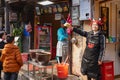 Shop assistants bartering their goods at Ciqikou