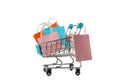 Shop cart with paper bags isolated on white background Royalty Free Stock Photo