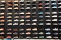 Shop display of a lot of Sports shoes on a wall. A view of a wall of shoes inside the store. Modern new stylish sneakers running Royalty Free Stock Photo