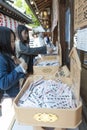 Shop inside Shinto shrine and Buddhist temple in Japan selling Omikuji or strips of paper with fortunes for visitors Royalty Free Stock Photo