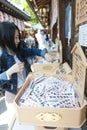 Shop inside Shinto shrine and Buddhist temple in Japan selling Omikuji or strips of paper with fortunes for visitors Royalty Free Stock Photo