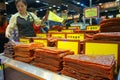 Shop-keeper sells assortment of Chinese preserved meat in Macau Royalty Free Stock Photo