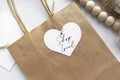 `Shop local` text on a gift tag and brown paper bag Royalty Free Stock Photo