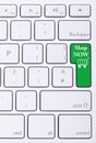 Shop now green key on aluminium keyboard Royalty Free Stock Photo