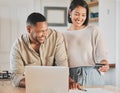 Shop online and get it in a flash. a young couple using a laptop and credit card at home. Royalty Free Stock Photo