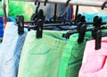 Shop pants hanging on a rack market.