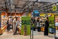 Shop for perfumes and cosmetics of various brands. Shoppers testing cosmetics and choosing goods to buy. Minsk, Belarus, 2022