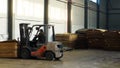 Shop for the production of plywood.The loader carries a stack of plywood. Business wood processing. Woodworking industry
