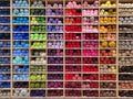 Shop shelf with multicolored yarn for knitting. Sale of goods for creativity and needlework. Bright colorful earn balls Royalty Free Stock Photo