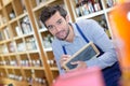 Shop vendor writing on blackboard