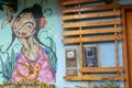 Shop wall with drawing of indigenous female in the small quaint town of CaetÃÂª-AÃÂ§u, Chapada Diamantina, Brazil