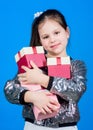 Shop for what you want. Girl with gift boxes blue background. Black friday. Shopping day. Child carry lot gift boxes Royalty Free Stock Photo