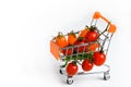 Shop wheelchair with cherry tomatoes, red tomatoes, cherry tomatoes, shop purchases close-up, decorated top view on Royalty Free Stock Photo