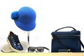 Shop window with bag, blue hat, sunglasses and sneakers