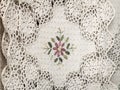 Tablecloths and napkins, decorated with embroidery and lace.