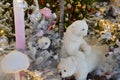 Shop window decoration, shopping center decor. artificial white spruce with garlands. next to them are two polar bear cubs. cute Royalty Free Stock Photo