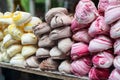 A shop window display of colourful meringues in an Amsterdam sweet shop.