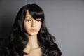 shop window mannequin or display dummy head with brunette wig and naturalistic face Royalty Free Stock Photo