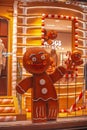 Shop window in Milan. Gingerbread classic cookie hero. Gingerbread men on display in a fashion store. BOGGI MILANO the