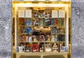 The shop window with sweets and alcoholic drinks at the Via Tommaso Grossi street in Milan, Italy