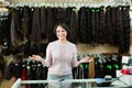 Shop woman posing at counter with artificial