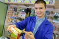 Shop worker holding spark plugs