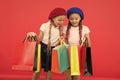 Shopaholic concept. Signs you are addicted to shopping. Kids cute schoolgirls hold bunch shopping bags. Children pupils