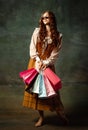 Vintage style portrait of pretty redhead woman with long curly hair like girl of renaissance eras, lady-peasant Royalty Free Stock Photo