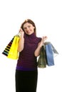 Shopaholic woman with colorful bags over white Royalty Free Stock Photo