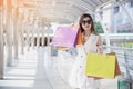 Shopaholic Women holding shopping bags ,money ,credit card person at shopping malls.Fashionable Woman love online website with Royalty Free Stock Photo