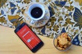 shopee apps on smartphone, with coffe and cake