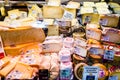 Shopfront with different cheeses at Boqueria Market. Barcelona