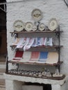 Shopfront display outside a whitewashed trullo building in Alberobello, Puglia, Southern Italy