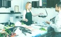 Shopgirl in fresh fish store Royalty Free Stock Photo