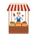 Shopkeeper with grocery stand