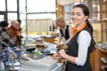 Shopkeeper and saleswoman at cash register or cash desk Royalty Free Stock Photo