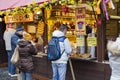 Shopkeeper selling czech honeywine (mead) at traditional Easter markets on Old Towns Square, Prague