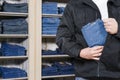 Shoplifter stealing denim