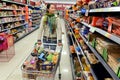 Shopper Browses Supermarket Aisle