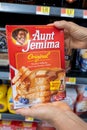 Los Angeles, CA, USA December 20th, 2021 Shopper hands holding a package of Aunt Jemima brand pancake and waffle mix for sale in a Royalty Free Stock Photo