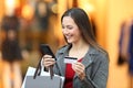 Shopper paying on line with credit card in a mall