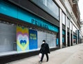 Shopper walks past Primark flagship store, Oxford Street, London Royalty Free Stock Photo