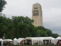 Crowd and vendor tents at the Ann Arbor Art Fair by the Burton Memorial Tower