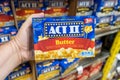 Shoppers hand holding a box of ACT II microwaveable popcorns Royalty Free Stock Photo