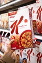 Shoppers hand holding a Box of Kellogg`s brand cereal Royalty Free Stock Photo