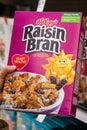 Shoppers hand holding a Box of Kellogg`s brand Raisin Bran Royalty Free Stock Photo